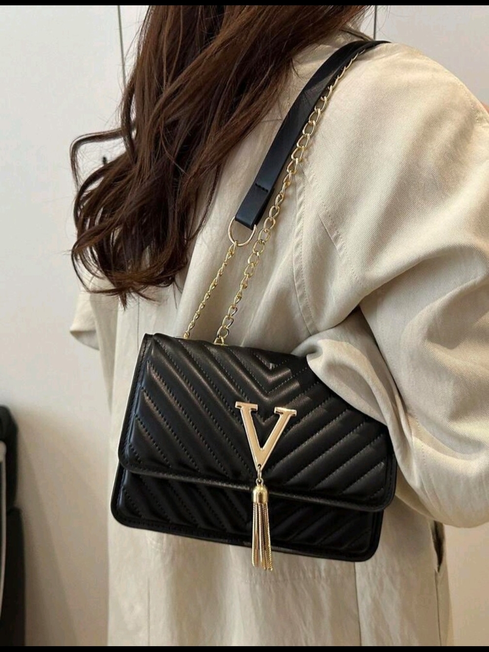 Black Quilted Shoulder Bag with Gold V-Tassel Accent